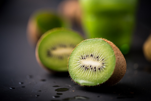 Slice of kiwi fruit isolated on white background