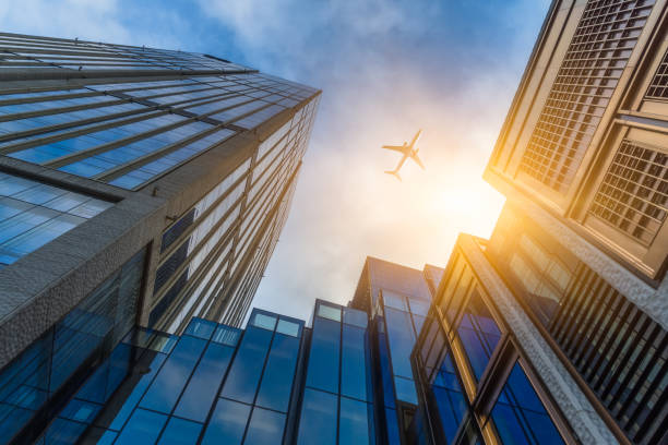 istock Plane flying over the skyscrapers 1031287852