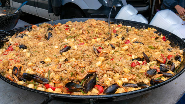 istock large dish of paella on the market 1031291908