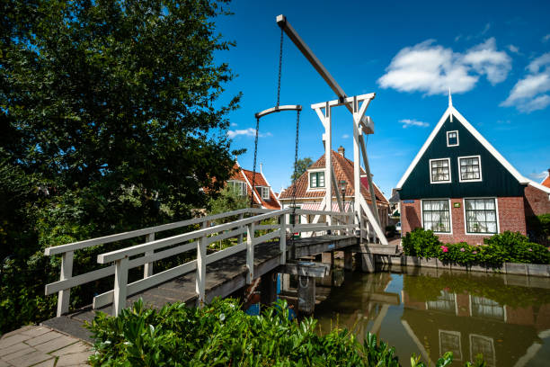 istock Typical dutch white wooden drawbridge. Architecture for over channels, ditches or rivers in old villages or cities 1031295272