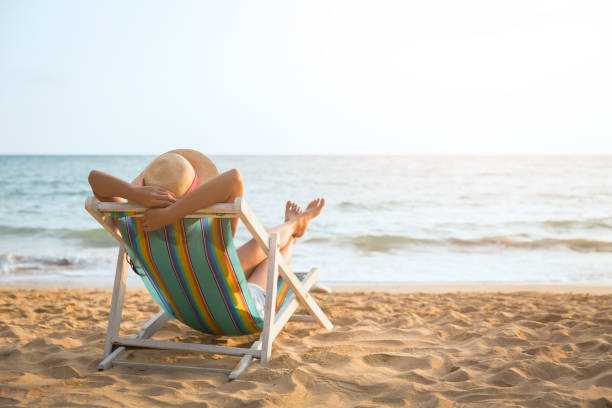 istock Woman on beach in summer 1031303568