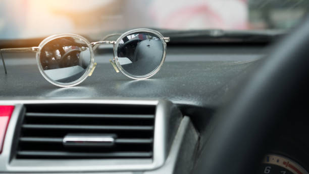 istock Sunglasses on console car and sunset 1031306706
