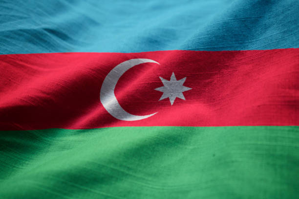 nahaufnahme der gekräuselten aserbaidschan fahne - azerbaijan flag stock-fotos und bilder