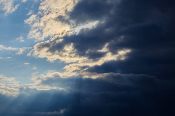 istock The rays of the sun make their way through the blue clouds 1031312382