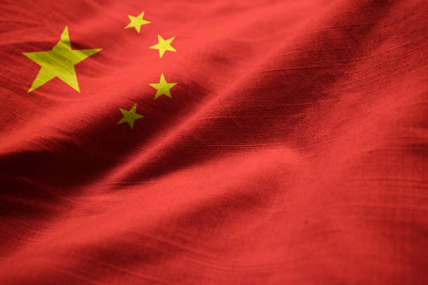 closeup of ruffled china flag - chinese flag imagens e fotografias de stock
