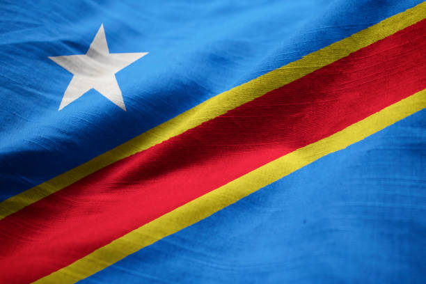 Closeup of Ruffled Democratic Republic of the Congo Flag Closeup of Ruffled Democratic Republic of the Congo Flag, Democratic Republic of the Congo Flag Blowing in Wind democratic republic of the congo stock pictures, royalty-free photos & images