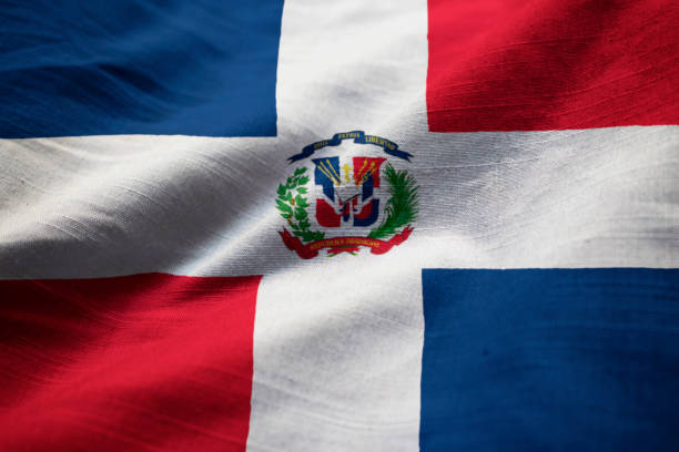 крупным планом взъерошенный флаг доминиканской республики - dominican flag стоковые фото и изображения