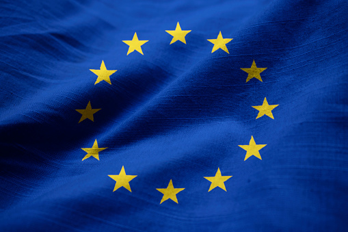 European Union Flag On Blue Sky With Copy Space