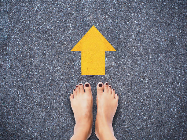 istock Selfie woman feet on concrete road 1031320492