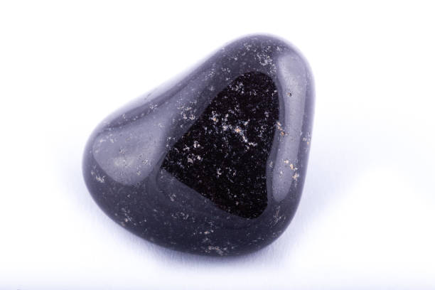 istock Macro mineral stone black Onyx on white background close up 1031333636