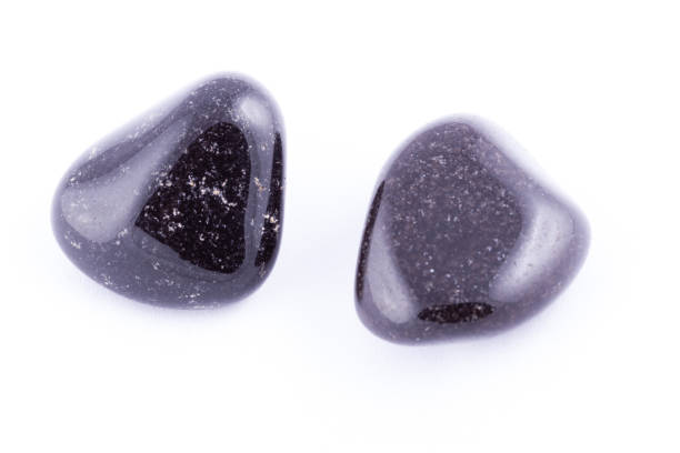 istock Macro mineral stone black Onyx on white background close up 1031333676