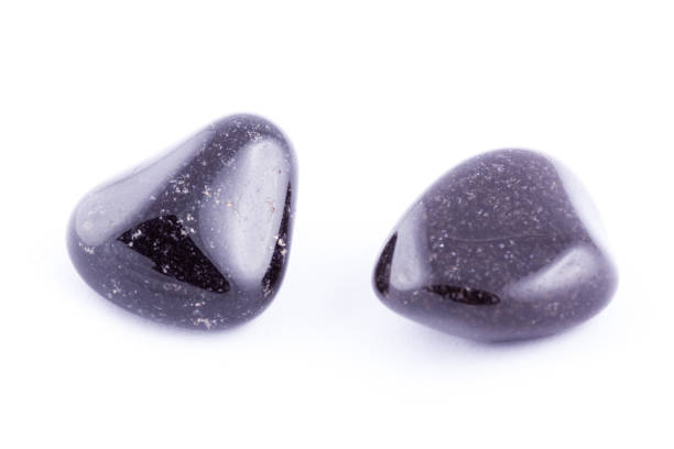 istock Macro mineral stone black Onyx on white background close up 1031333692