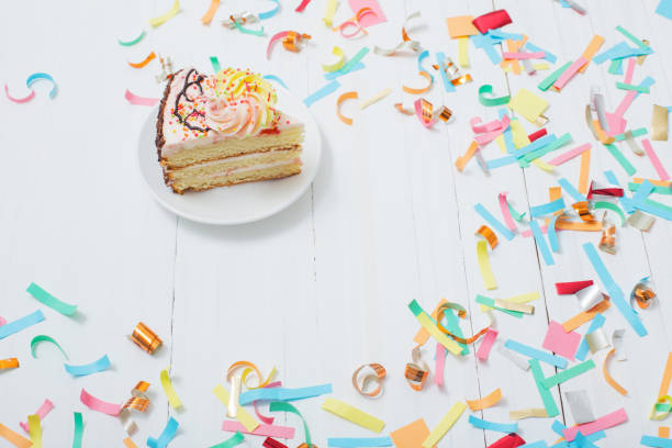 istock birthday cake and  decoration on white wooden background 1031337128