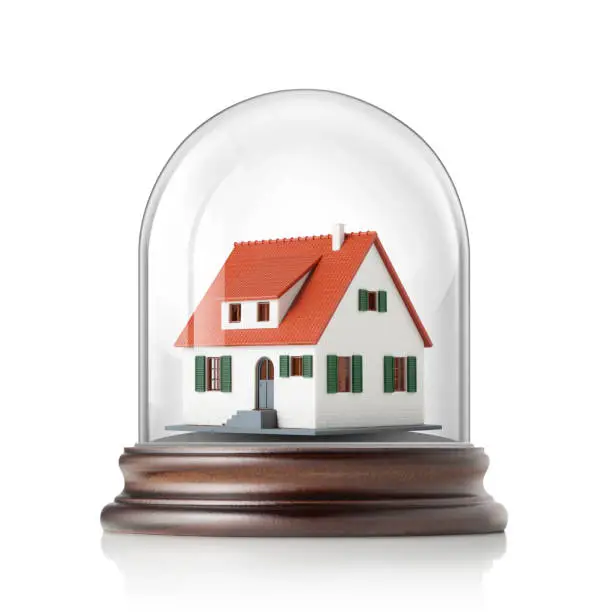 House in glass bell jar on white background.