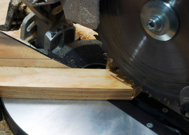 istock Carpenter tools on wooden table with sawdust. Circular Saw. Cutting a wooden plank 1031340716