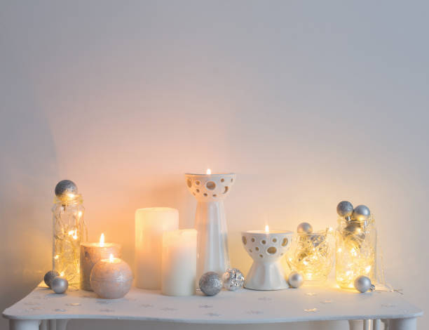 istock Christmas decoration with candles on background  white wall 1031343914