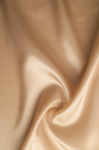 istock Texture background of fabric. Beige fabric. Silk fabric wallpaper texture background pattern in sepia pastel yellow cream beige tint: Lovely natural silk textured textile 1031344396
