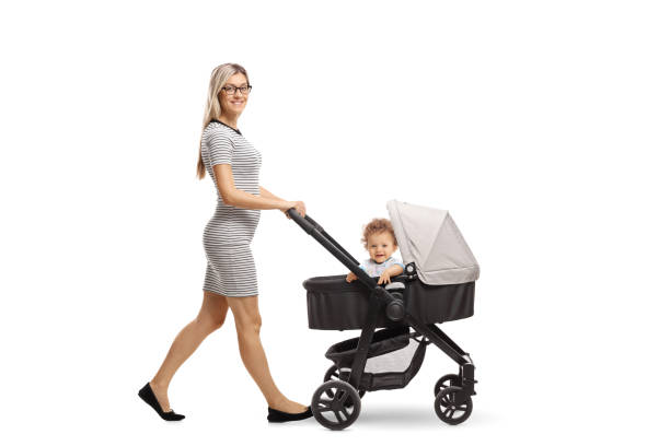 istock Young mother pushing a stroller with a baby 1031348496