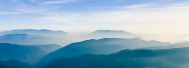 istock Overlooking the rolling mountains, panoramic view, standing on the top of Jade Dragon Snow Mountain in Lijiang City, Yunnan Province, China 1031354416