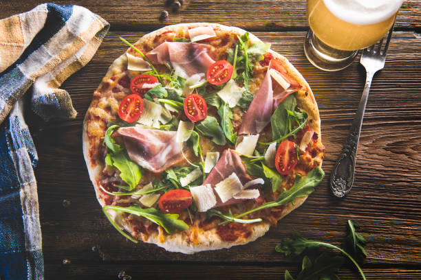 istock Hot italian pizza on wooden table 1031354606