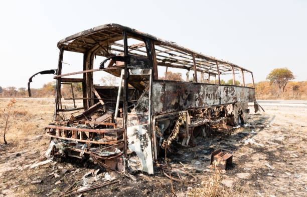 istock Burned bus at the side of the road 1031356924