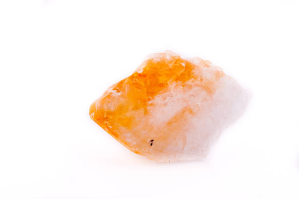 Macro mineral of Citrine stone on white background close up