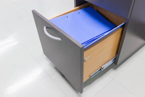 istock blue file folder documents In a file cabinet retention of contracts 1031358646