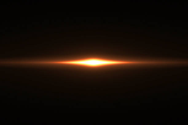 istock gold warm color bright lens flare rays light flashes leak movement for transitions on black background,movie titles 1031359196