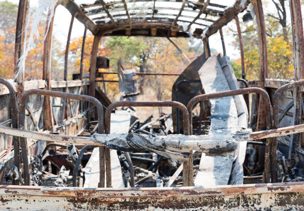 istock Burned bus at the side of the road 1031359622