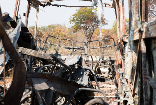 istock Burned bus at the side of the road 1031361890