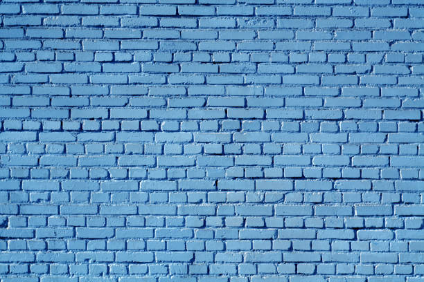 istock Blue color old grungy brick wall surface. 1031362882