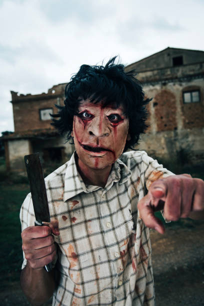 istock scary disfigured man wielding a cleaver 1031365062