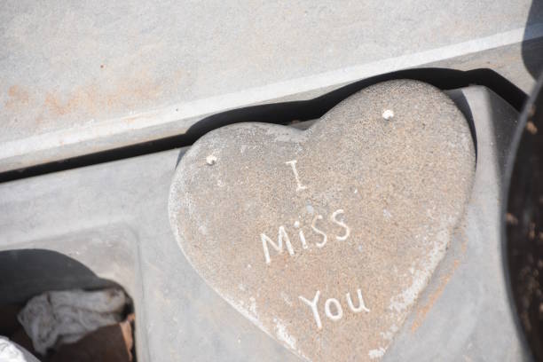istock Sad heart with caption On a new grave 1031365684