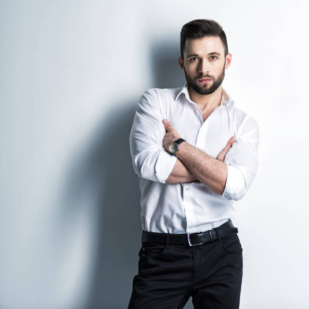 istock Handsome man in white shirt holds the black suit 1031366498