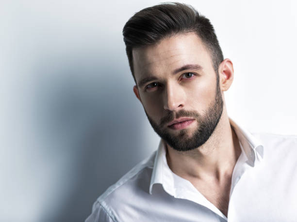 istock Handsome man in white shirt. Closeup portrait. 1031366546