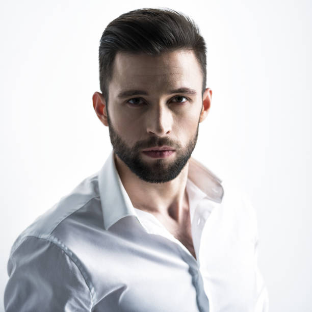 istock Handsome man in white shirt. Closeup portrait. 1031366554