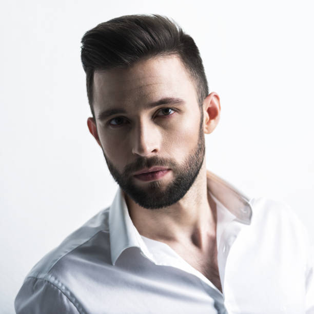 istock Handsome man in white shirt. Closeup portrait. 1031366562