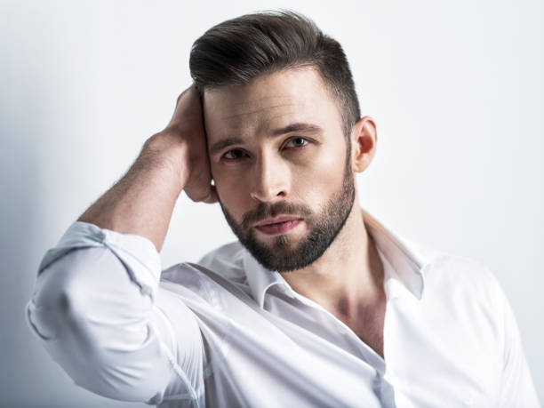 istock Handsome man in white shirt. Closeup portrait. 1031366574