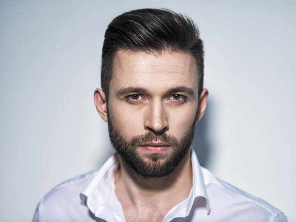 istock Handsome man in white shirt. Closeup portrait. 1031366576