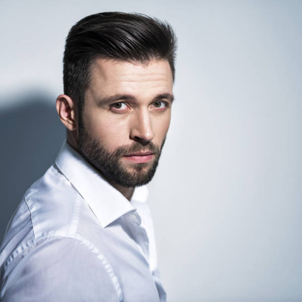 istock Handsome man in white shirt. Closeup portrait. 1031366590