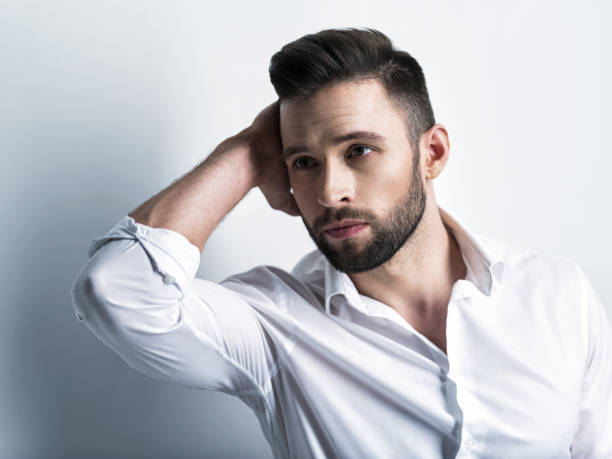 istock Handsome man in white shirt. Closeup portrait. 1031368002
