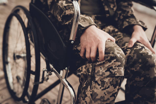 istock Disabled Soldier In A Wheelchair. Paralyzed Man. 1031369696