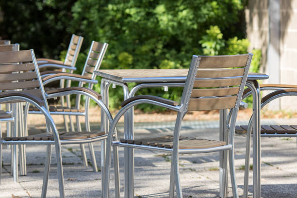 istock Empty contemporary tables and chairs outside a bar restaurant. 1031369880