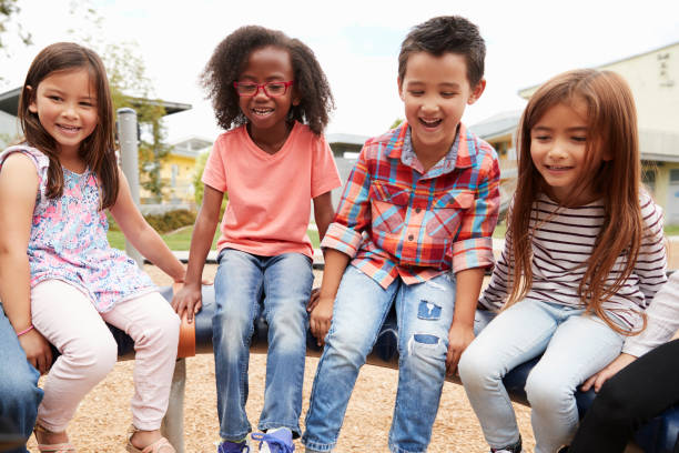 istock Kids sitting on a spinning carousel in their schoolyard 1031381474