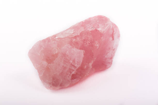 istock Macro mineral stone Pink quartz on a white background close up 1031381642
