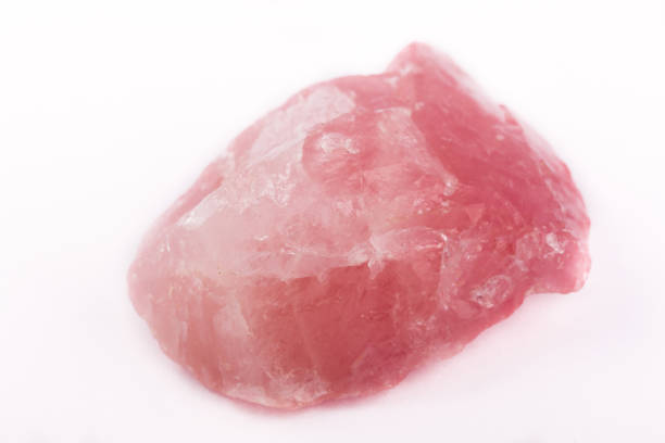istock Macro mineral stone Pink quartz on a white background close up 1031381722