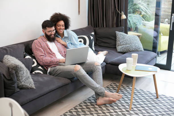 istock Mixed race couple in living room 1031384512