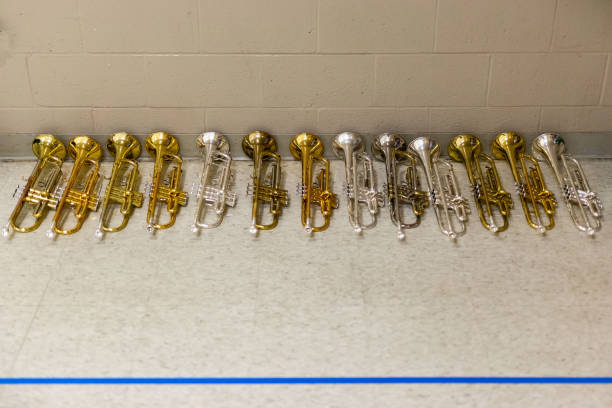 istock row of resting trumpets during marching practice 1031385280