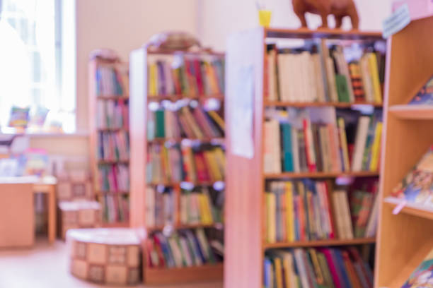 istock public library for children defocused intereor. shelving with books 1031385432