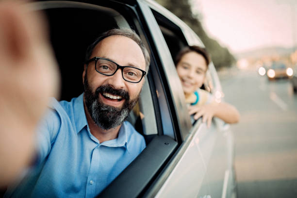 istock Father driving his son to school 1031386810